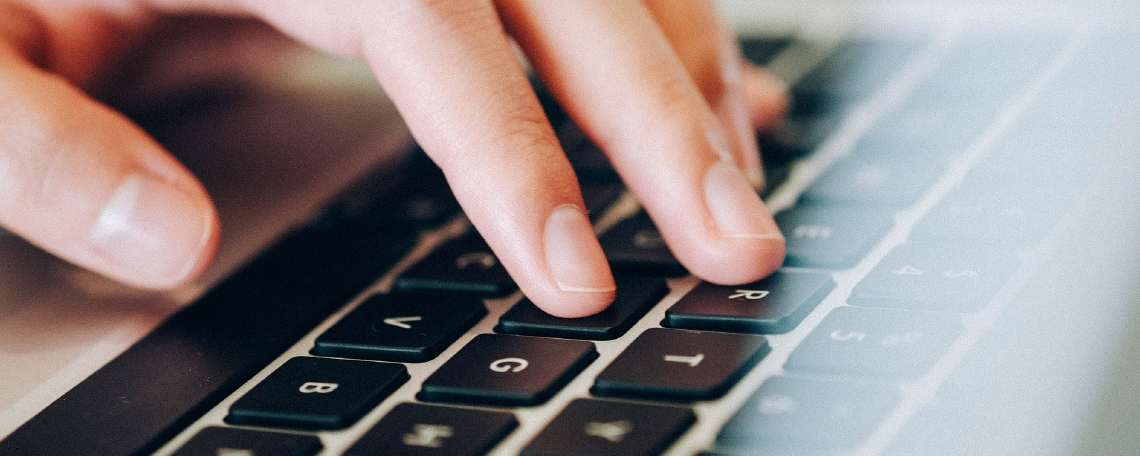 Hand on computer keyboard